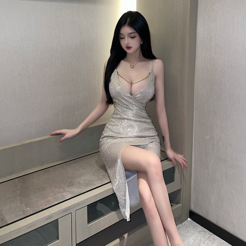 My Store 3 nightclub dress featuring a low V-neck and high slit design, shown on a model. Elegant evening wear for parties.