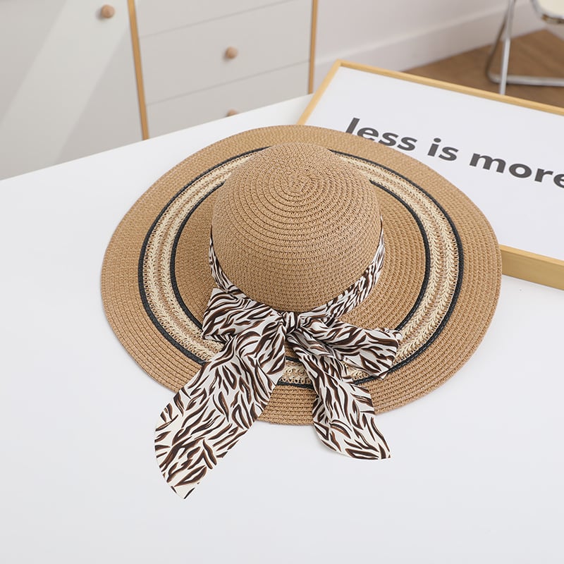 Stylish women's foldable beach hat with wide brim, featuring a trendy design by My Store 3, perfect for sunny outdoor looks.