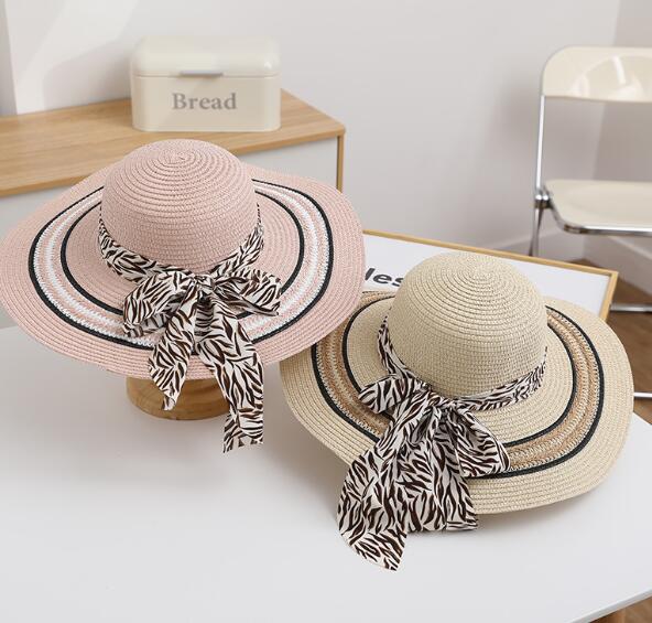 Stylish women's foldable beach hat with wide brim, lightweight fabric, and trendy design for sun protection and fashionable looks.
