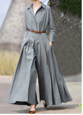 My Store 3 WOLFF long sleeve pleated jumpsuit, stylish one-piece with a fitted waist and elegant pleats, modeled on a mannequin.