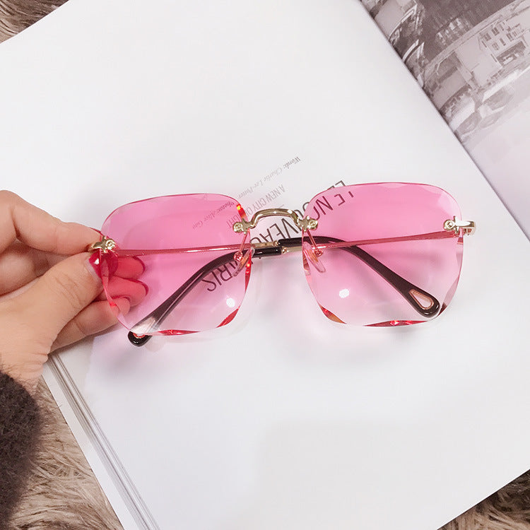 Trendy square frameless sunglasses with polygonal lenses by My Store 3, showcasing modern eyewear design and sleek frame.